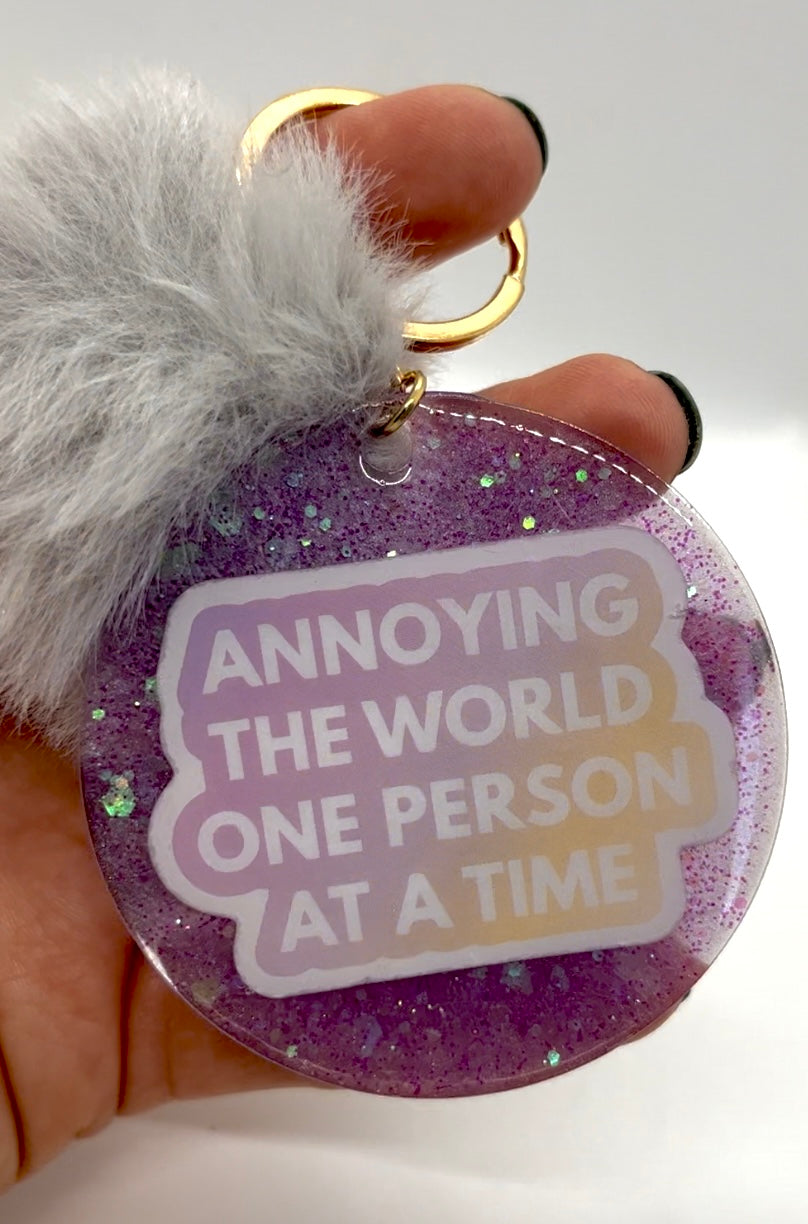 Annoying the world one person at a time Keychain